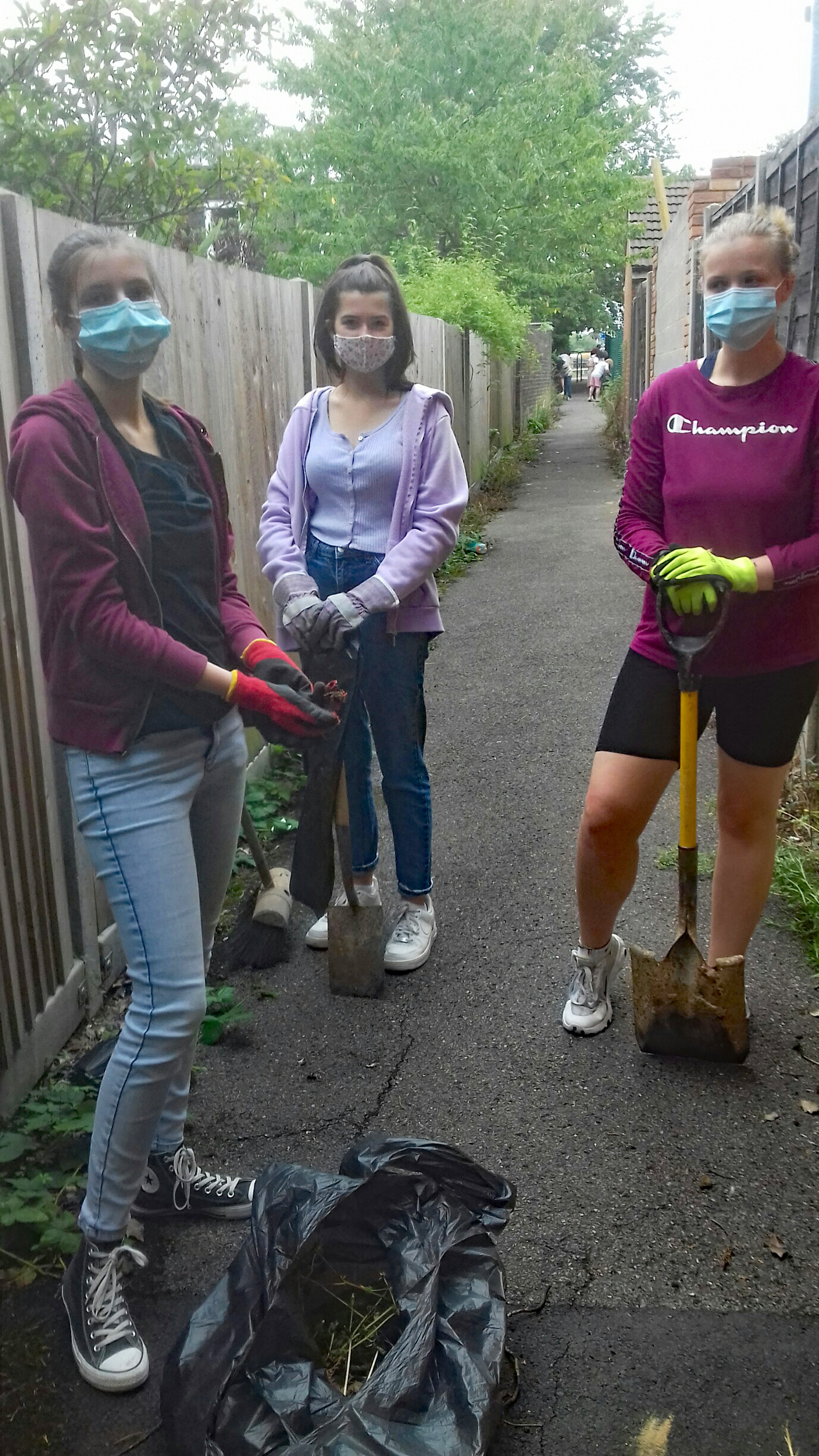 Young Persons SVP working on clearing a foot path