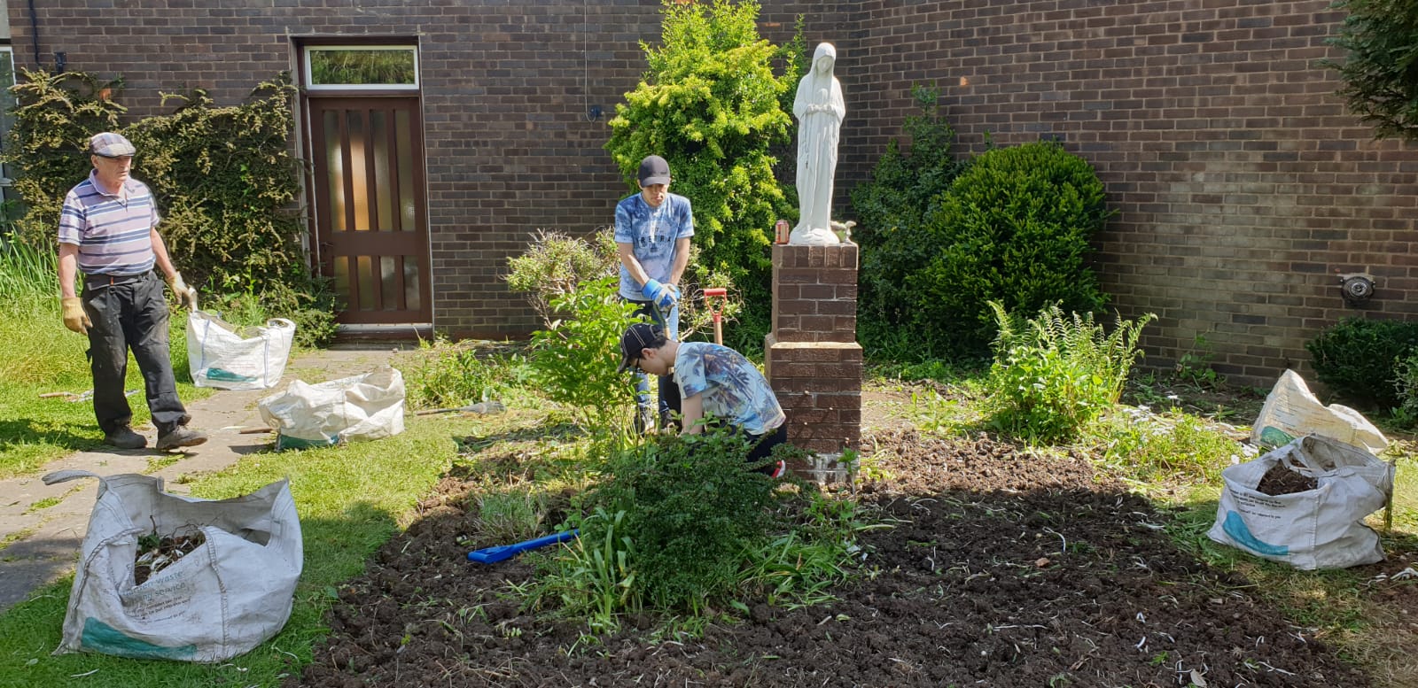 B-Attitudes working on Parish garden.